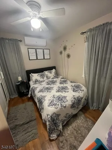 a bedroom with a bed and a mirror
