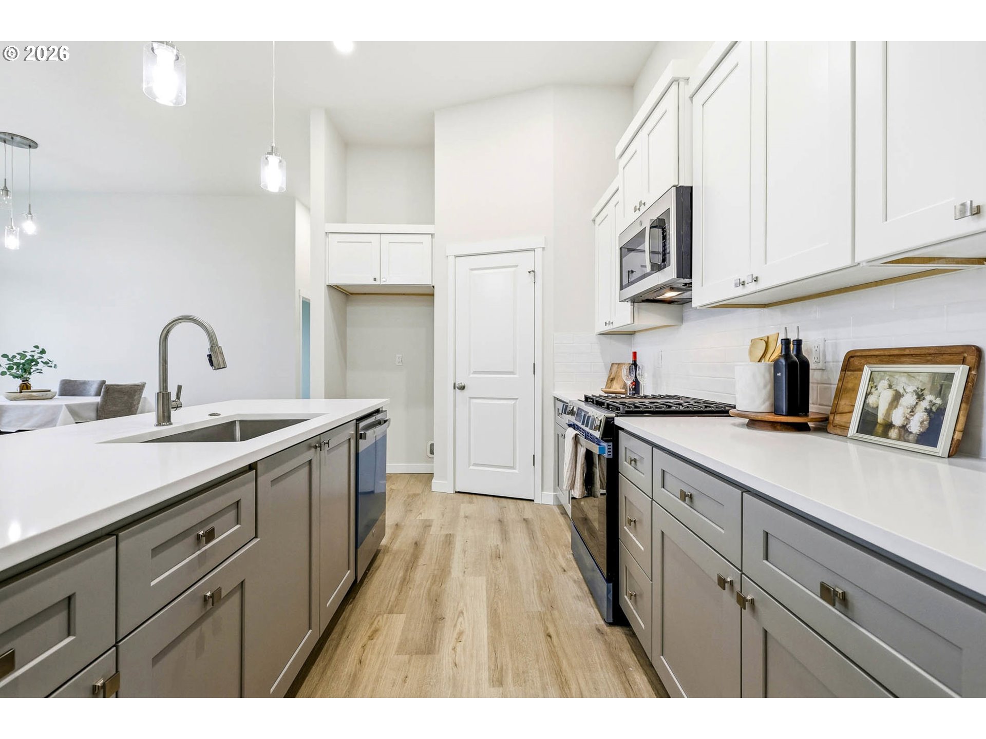 1327 Southeast 9th Street Hermiston, OR 97838 - Photo 12 of 28 a kitchen with cabinets a sink and appliances