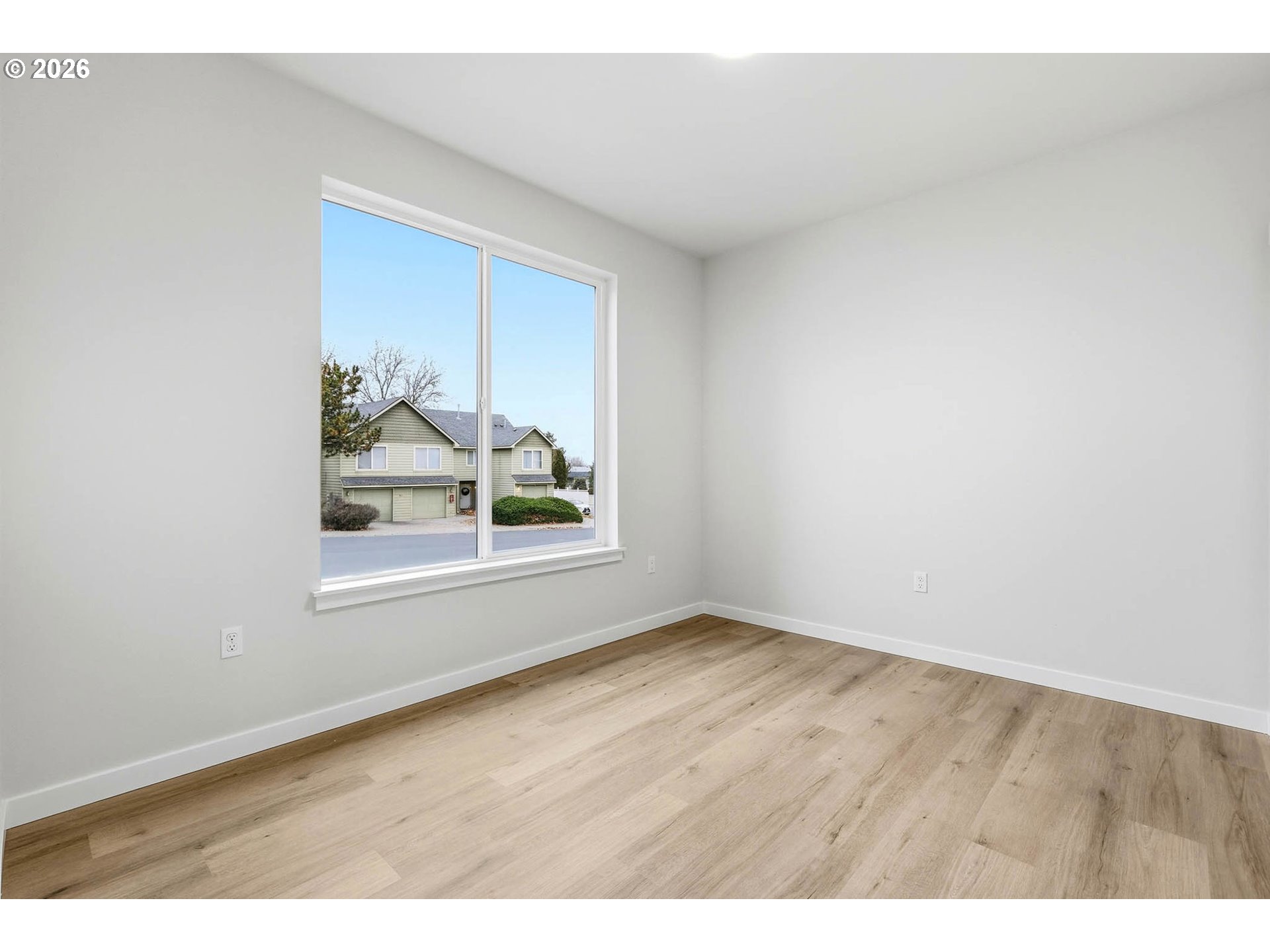 1327 Southeast 9th Street Hermiston, OR 97838 - Photo 15 of 28 a view of an empty room with a window