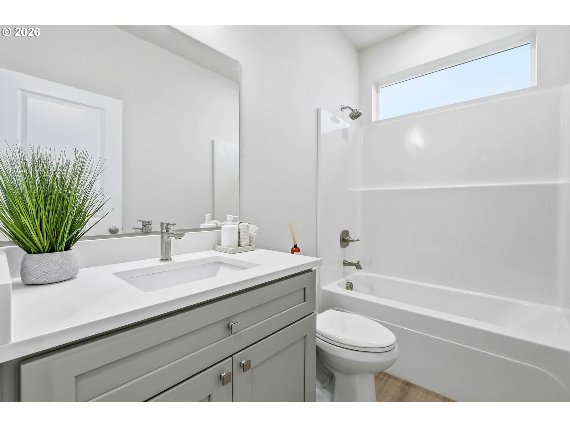 1327 Southeast 9th Street Hermiston, OR 97838 - Photo 17 of 28 a bathroom with a granite countertop sink a toilet a mirror and shower