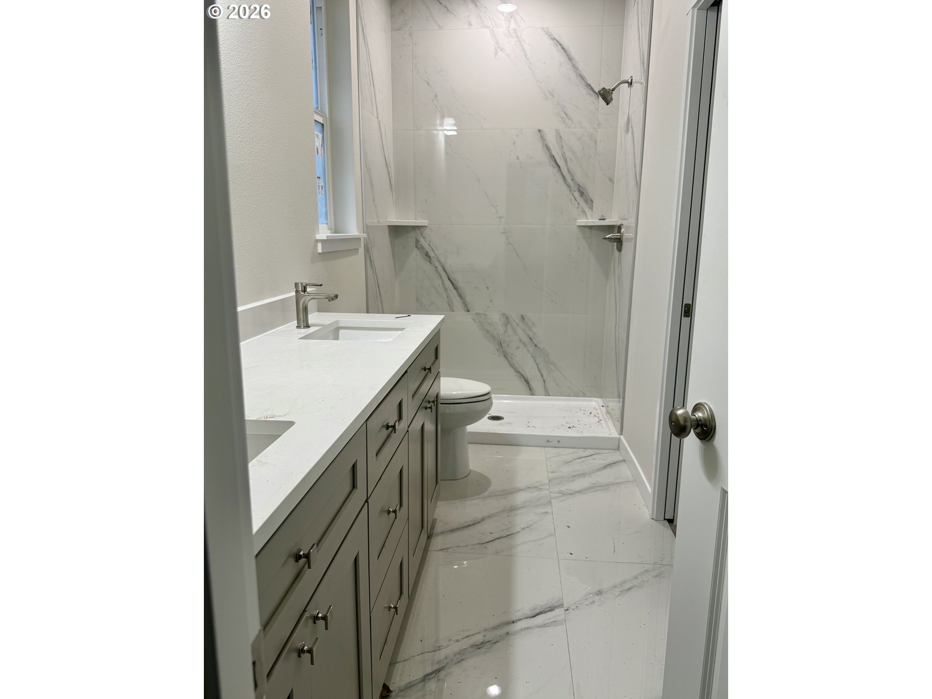 1327 Southeast 9th Street Hermiston, OR 97838 - Photo 4 of 6 a bathroom with a sink a toilet and shower