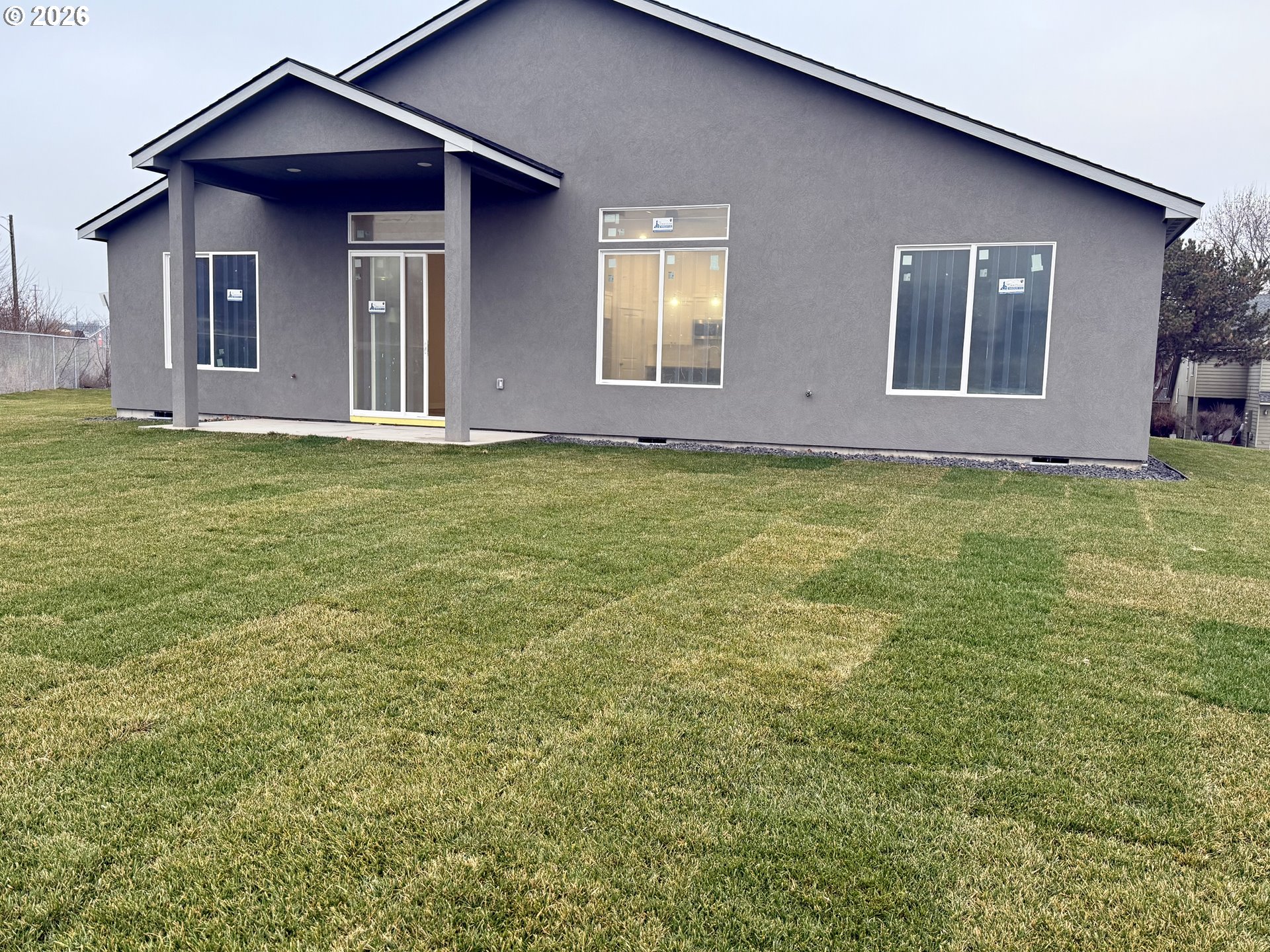 1327 Southeast 9th Street Hermiston, OR 97838 - Photo 6 of 6 a view of a house with a yard and wooden fence