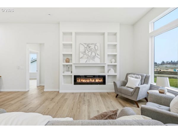 1327 Southeast 9th Street Hermiston, OR 97838 - Photo 7 of 28 a living room with furniture and a fireplace