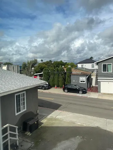 a view of multiple car parked in front of house
