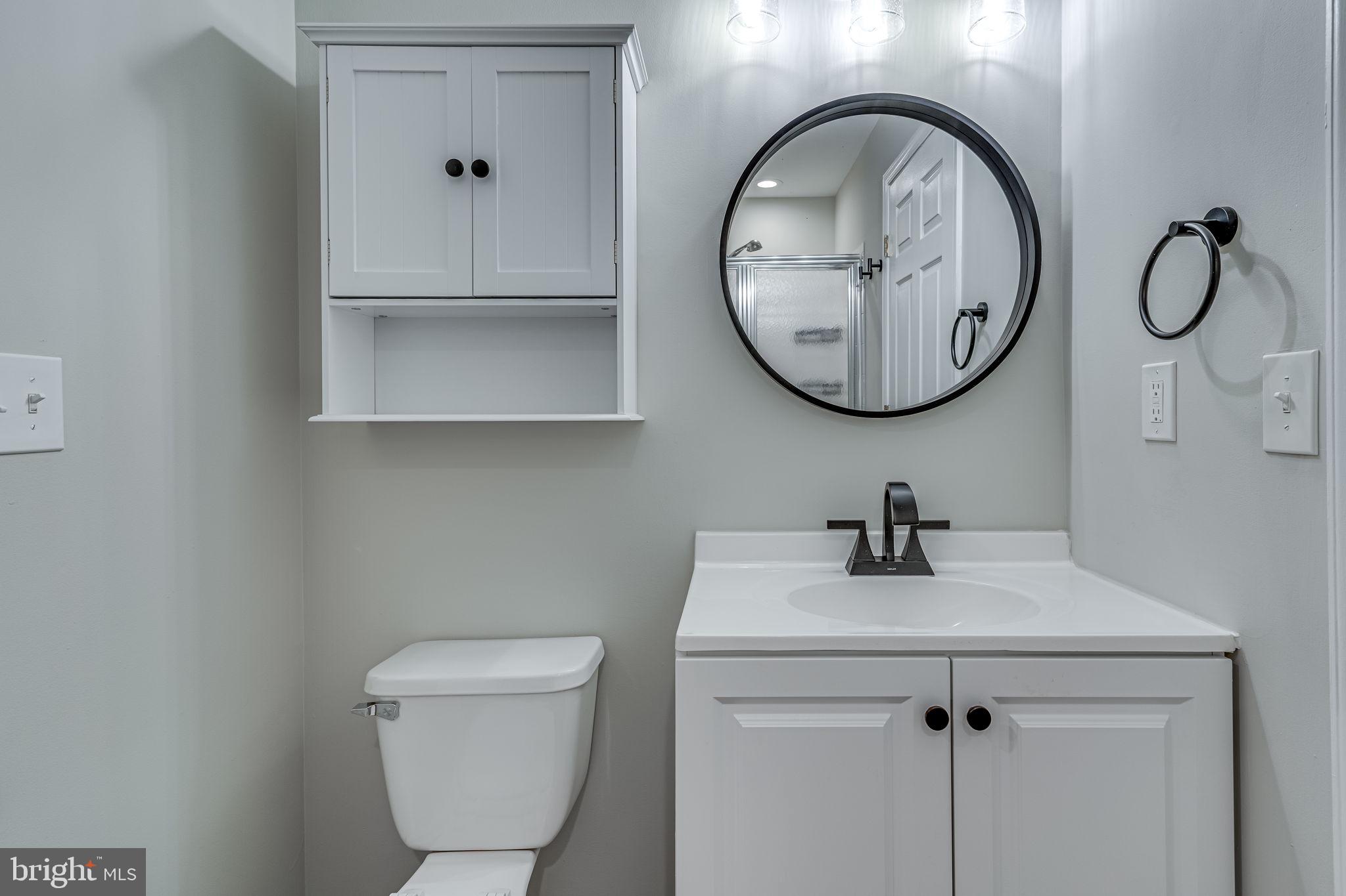 1067 Gardenview Loop, Unit 304 Woodbridge, VA 22191 - Photo 17 of 36 a bathroom with a toilet and a sink