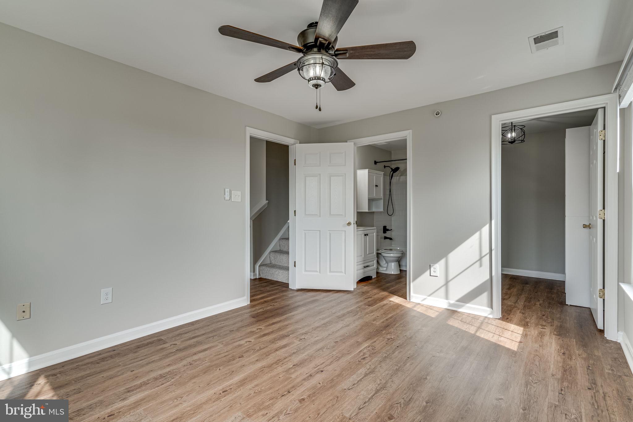 1067 Gardenview Loop, Unit 304 Woodbridge, VA 22191 - Photo 19 of 36 wooden floor in an empty room with a window
