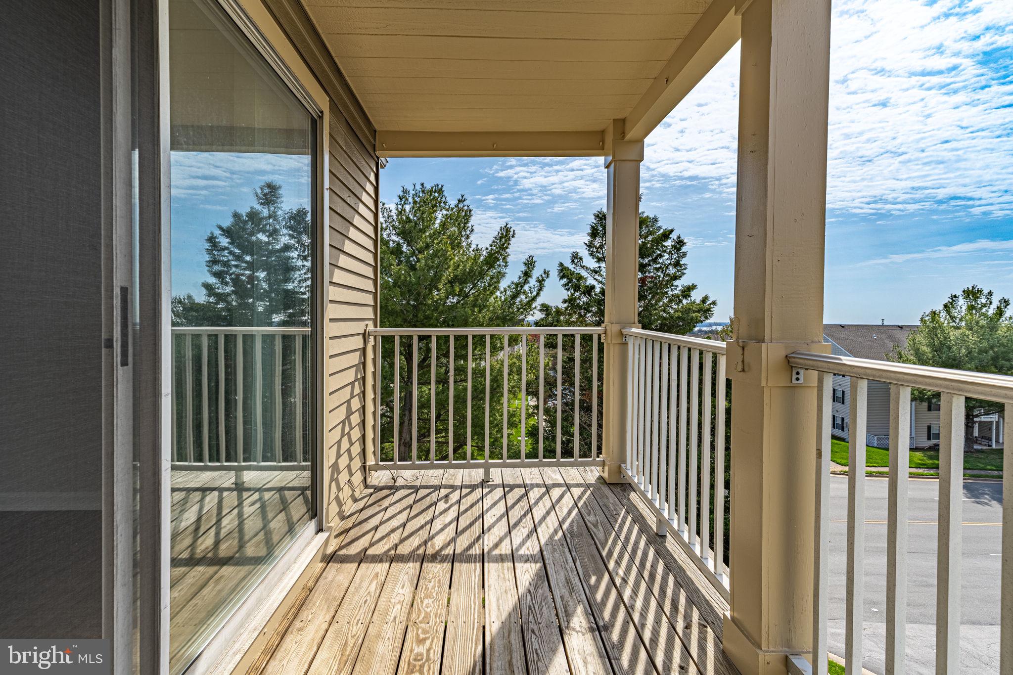 1067 Gardenview Loop, Unit 304 Woodbridge, VA 22191 - Photo 28 of 36 a view of a balcony with wooden floor