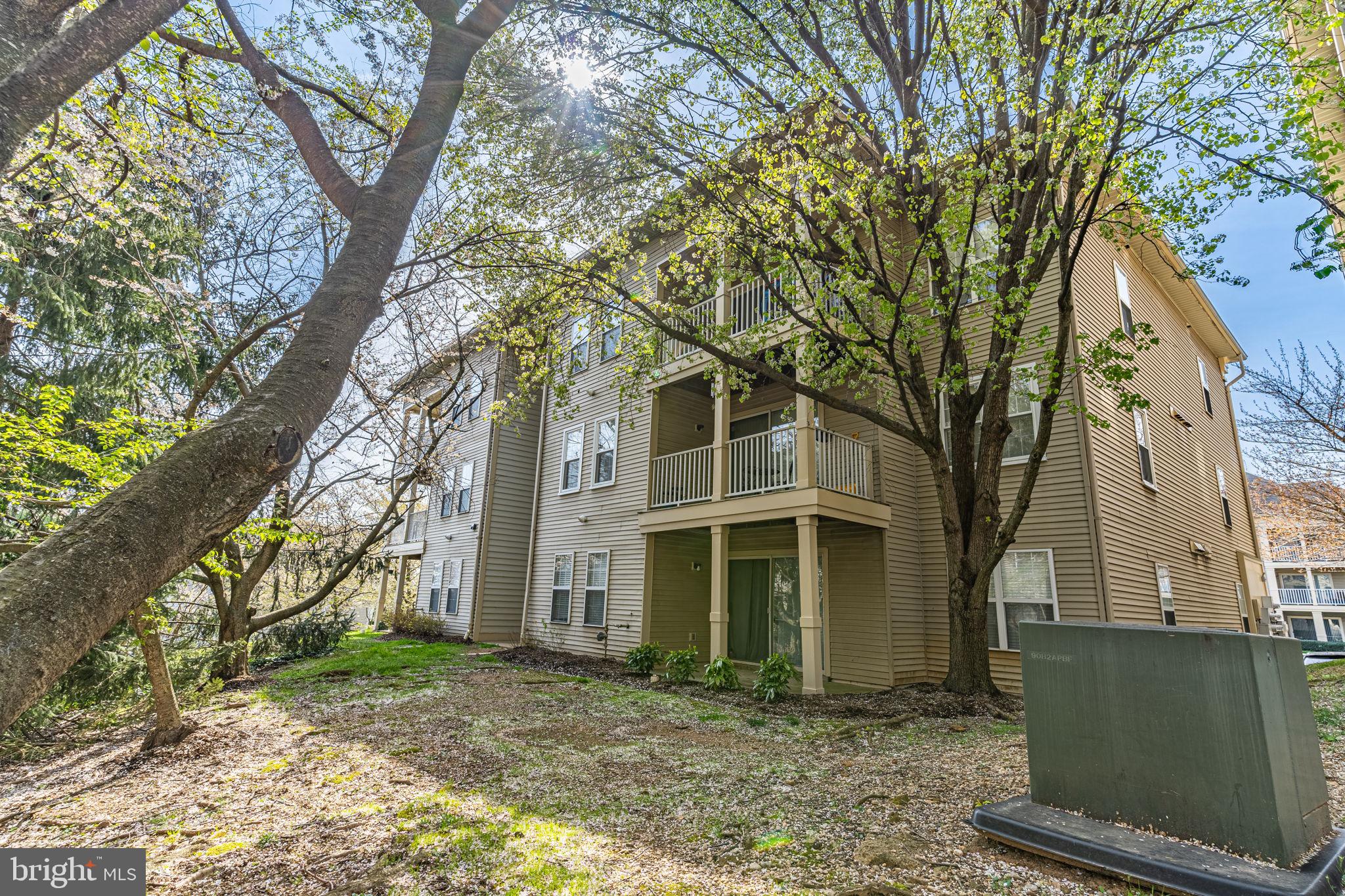 1067 Gardenview Loop, Unit 304 Woodbridge, VA 22191 - Photo 31 of 36 a view of a brick house with large windows