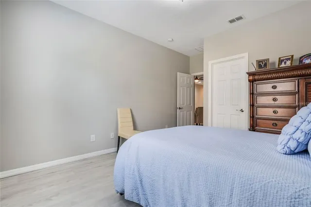 a bedroom with a bed and a closet