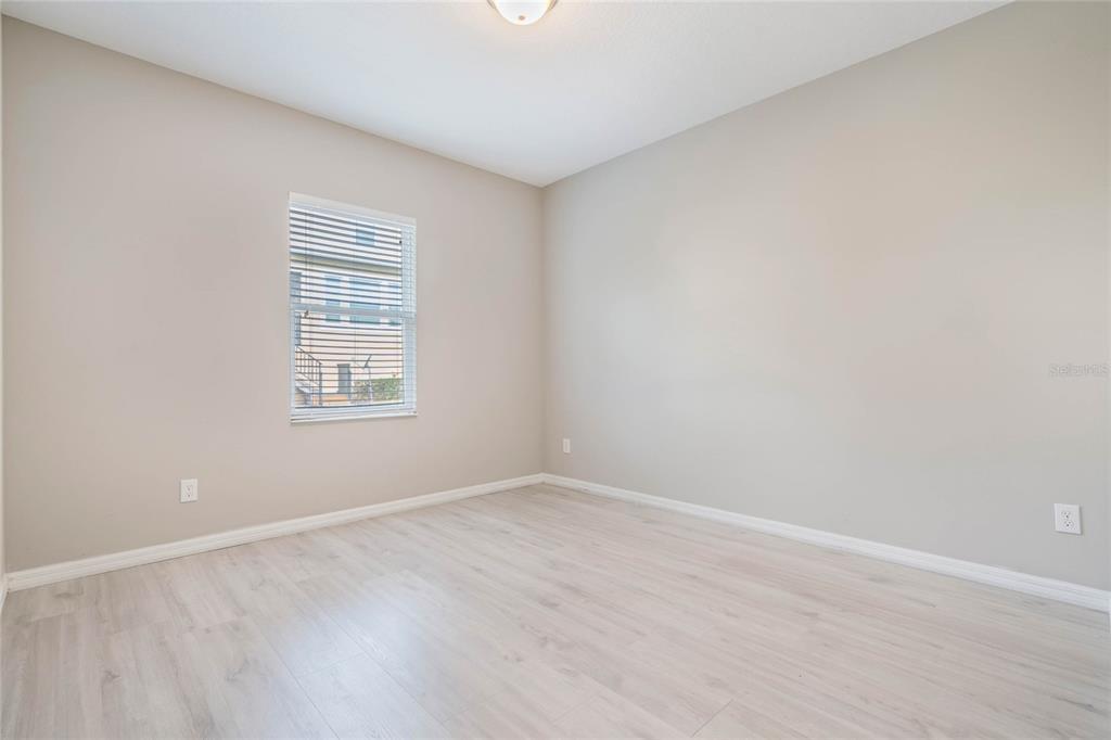 17523 Promenade Drive Clermont, FL 34711 - Photo 25 of 44 an empty room with windows