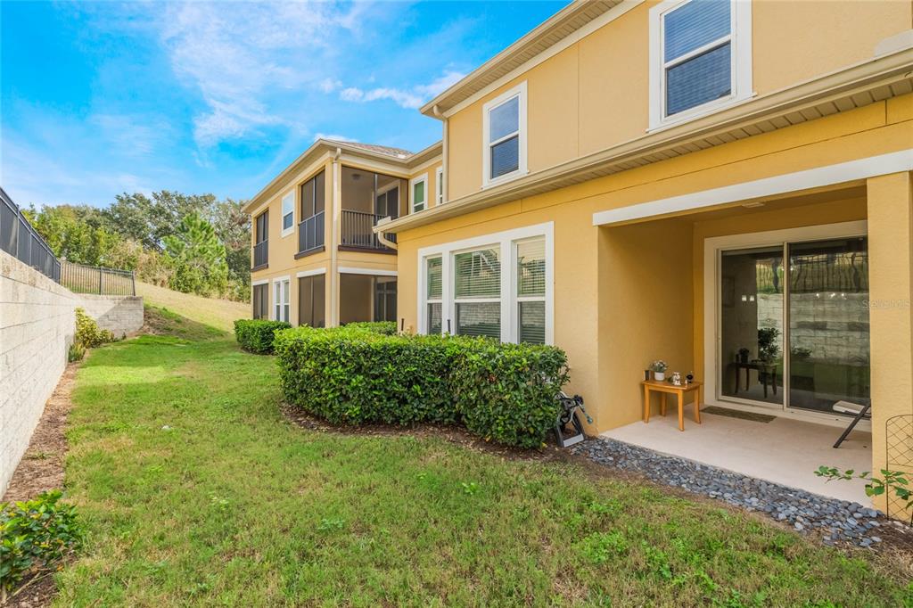 17523 Promenade Drive Clermont, FL 34711 - Photo 31 of 44 a front view of a house with garden