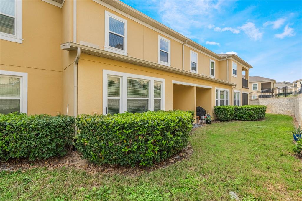 17523 Promenade Drive Clermont, FL 34711 - Photo 33 of 44 a view of a building with a garden