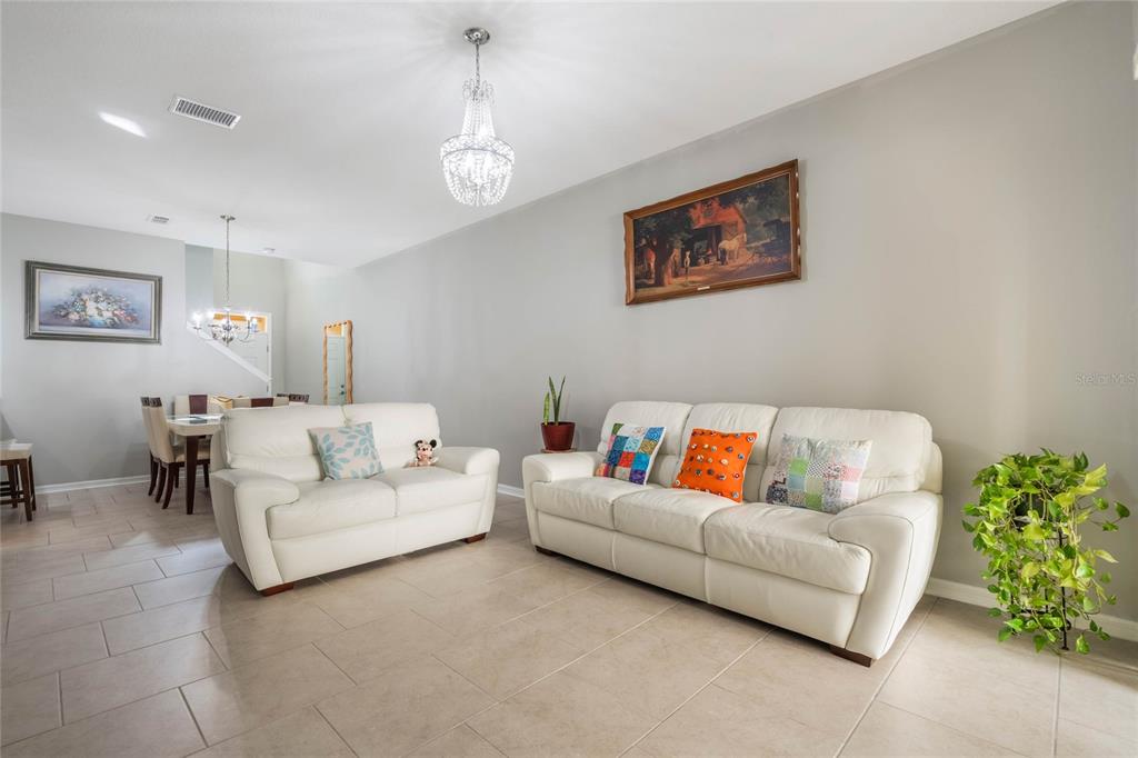 17523 Promenade Drive Clermont, FL 34711 - Photo 7 of 44 a living room with furniture and a couch