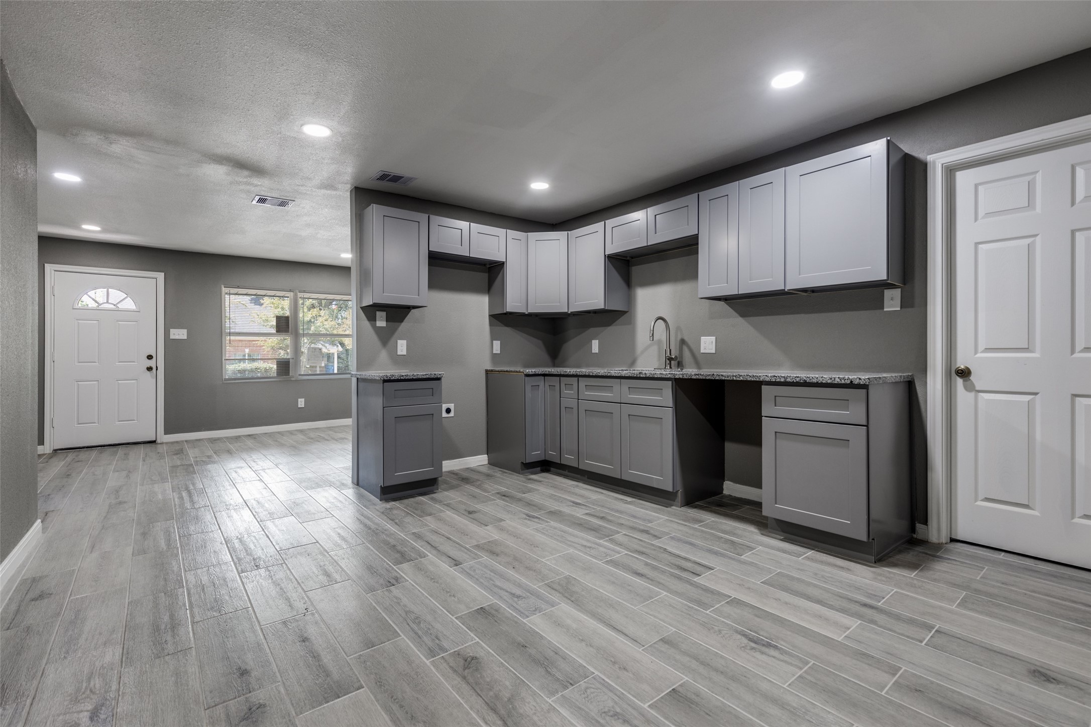 200 Pine Street Prairie View, TX 77446 - Photo 9 of 25 a kitchen with stainless steel appliances granite countertop a sink refrigerator and cabinets
