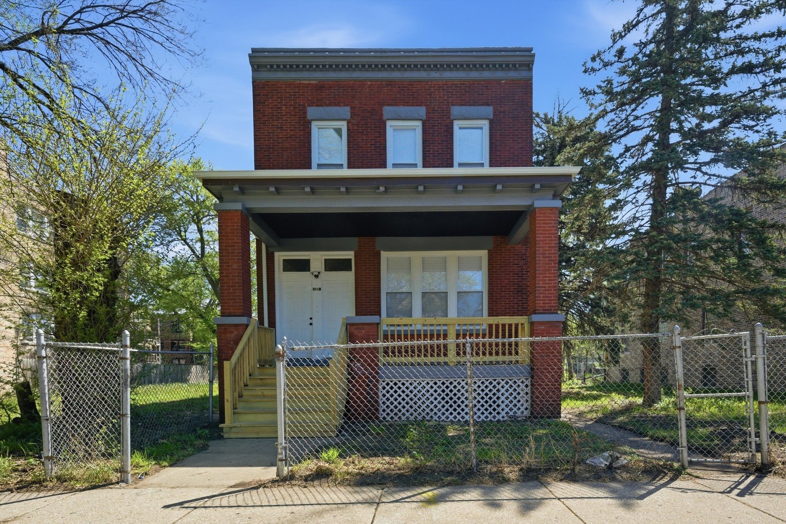 7017 South Normal Boulevard Chicago, IL 60621 - Photo 1 of 23 a front view of a house