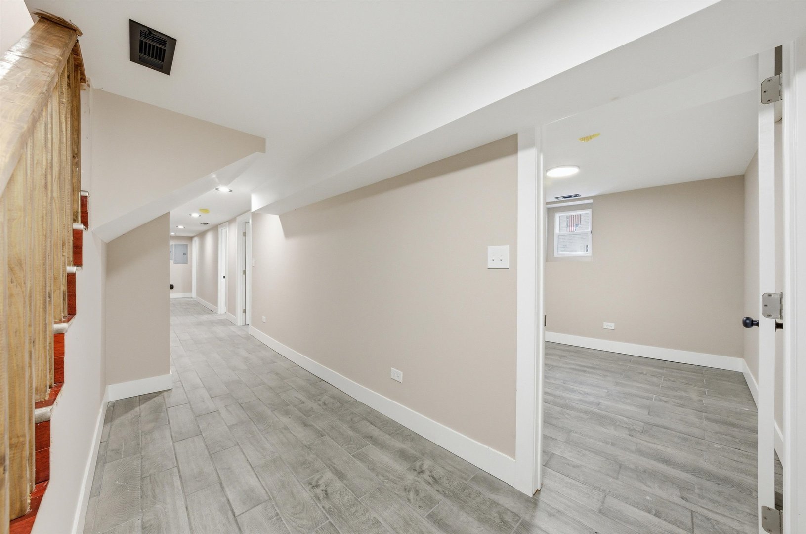 7017 South Normal Boulevard Chicago, IL 60621 - Photo 15 of 23 a view of a hallway with wooden floor