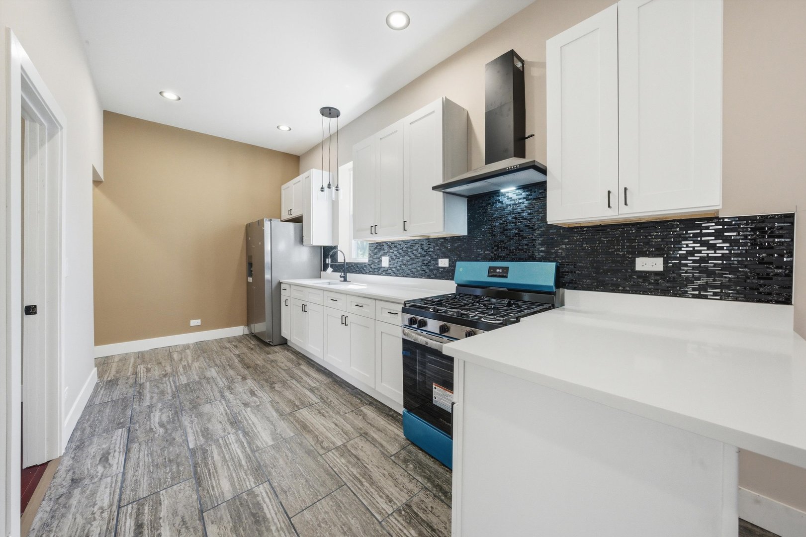 7017 South Normal Boulevard Chicago, IL 60621 - Photo 6 of 23 a kitchen with a stove and a white refrigerator