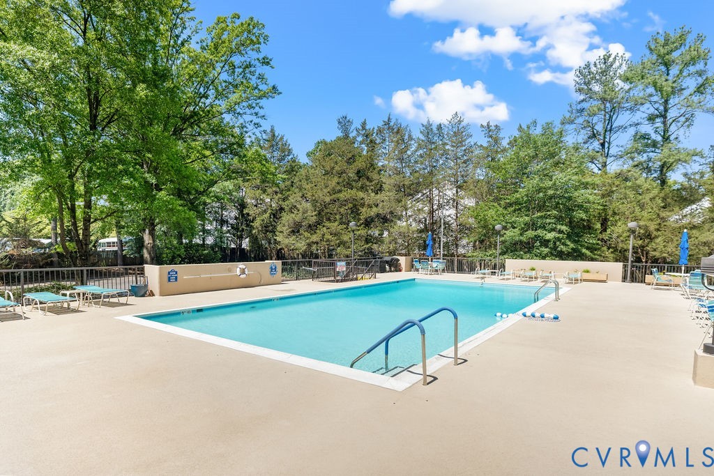 2956 Hathaway Road, Unit U704 Richmond, VA 23225 - Photo 38 of 42 Outdoor swimming pool surrounded by a light-colore