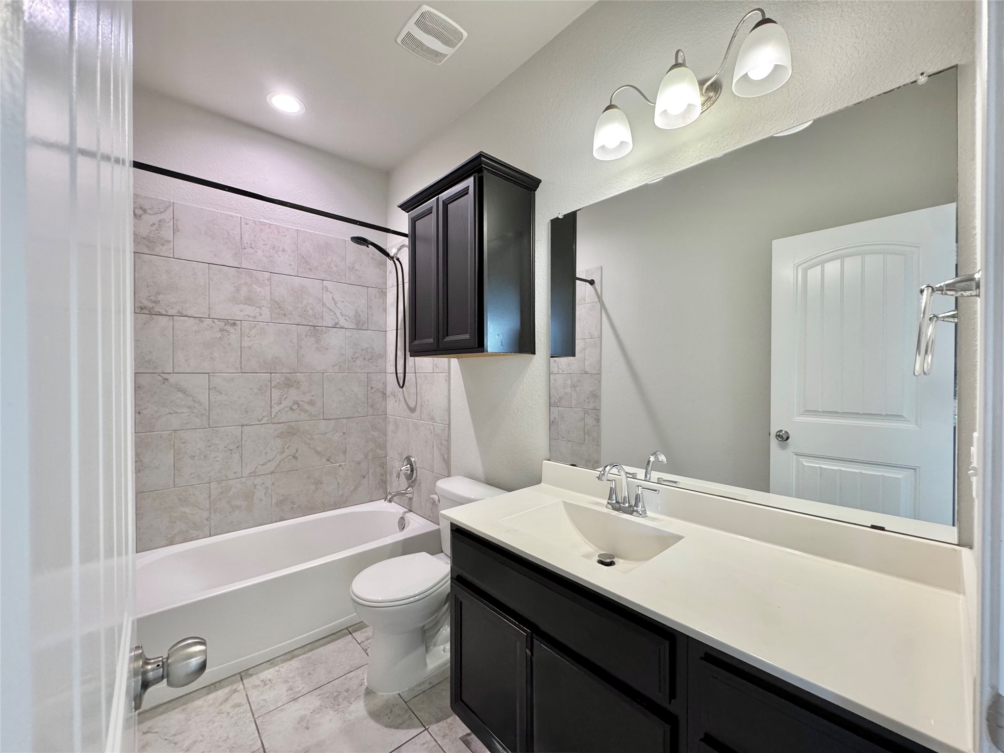407 Rhetoric Way Pflugerville, TX 78660 - Photo 21 of 38 a bathroom with a sink a toilet a mirror and shower