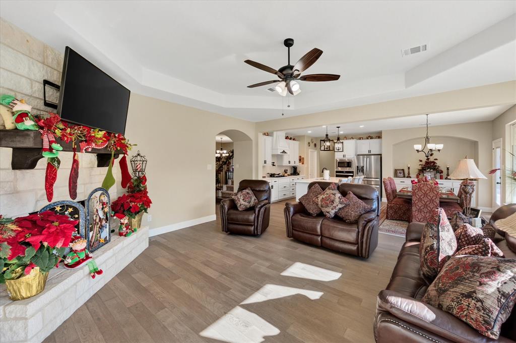 4434 Verbena Street Midlothian, TX 76065 - Photo 13 of 32 a living room with furniture and a flat screen tv