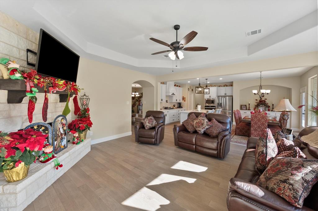 4434 Verbena Street Midlothian, TX 76065 - Photo 15 of 32 a living room with furniture and a flat screen tv