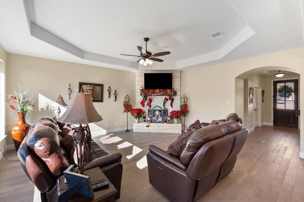 4434 Verbena Street Midlothian, TX 76065 - Photo 16 of 32 a living room with furniture and a ceiling fan