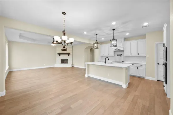 a view of an empty room with a ceiling fan