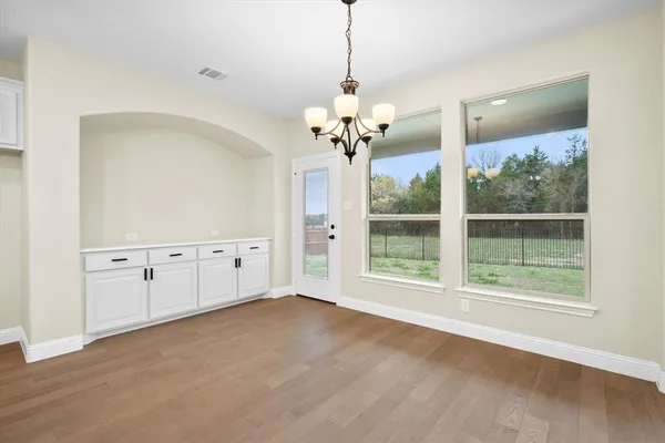 a view of room with window and ceiling fan