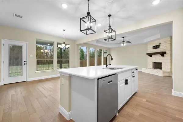a spacious bathroom with double sink and a mirror