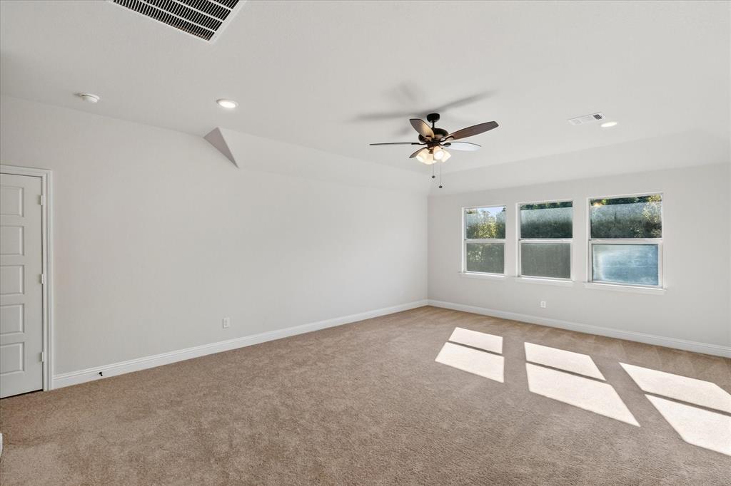 4434 Verbena Street Midlothian, TX 76065 - Photo 28 of 29 Empty room featuring recessed lighting, light colored carpet, and a ceiling fan
