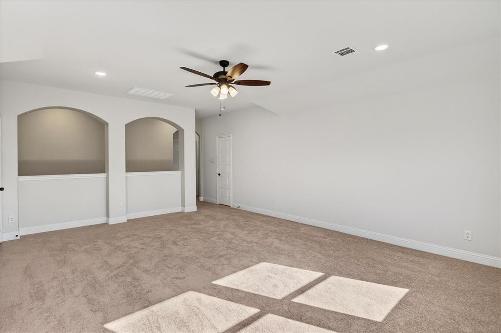 4434 Verbena Street Midlothian, TX 76065 - Photo 30 of 32 a view of a big room with a ceiling fan and window