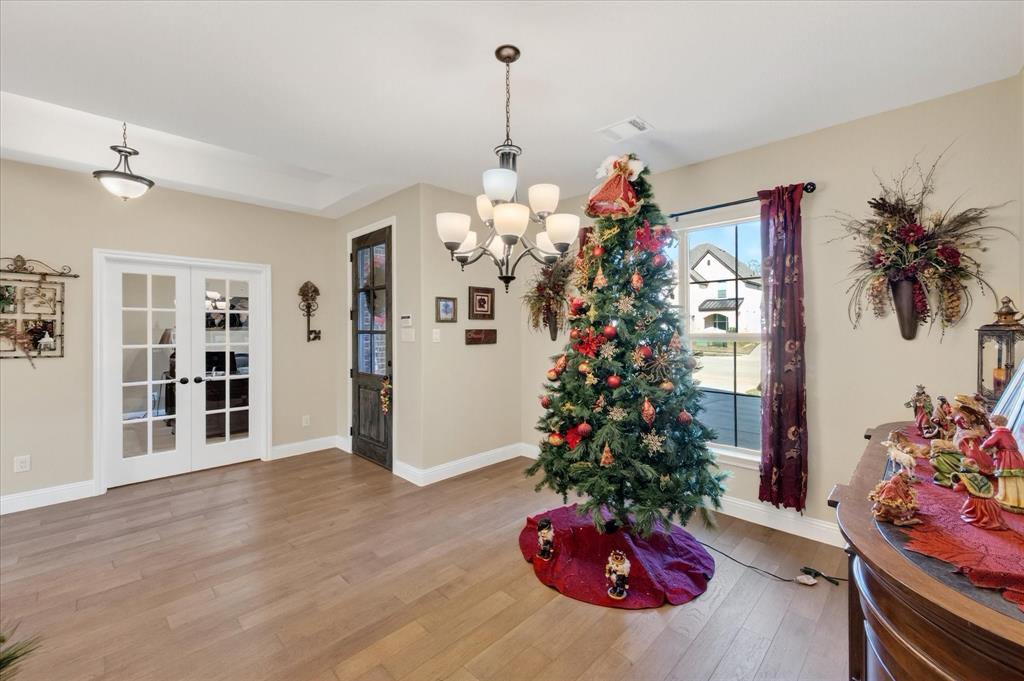 4434 Verbena Street Midlothian, TX 76065 - Photo 7 of 32 a flower room with a chandelier