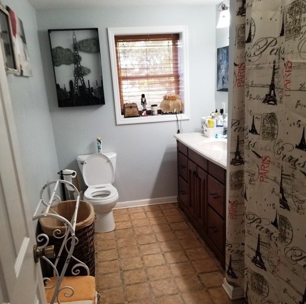 1248 Rutledge Ford Road Decherd, TN 37324 - Photo 11 of 13 a bathroom with a window and a mirror