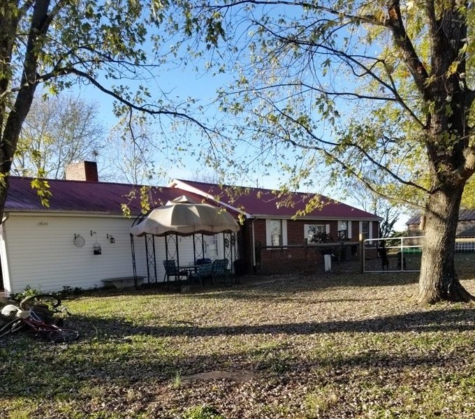 1248 Rutledge Ford Road Decherd, TN 37324 - Photo 13 of 13 a front view of a house with a yard