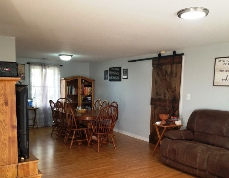 1248 Rutledge Ford Road Decherd, TN 37324 - Photo 5 of 13 a view of a dining room with furniture and wooden floor