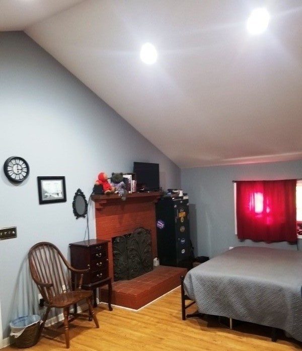 1248 Rutledge Ford Road Decherd, TN 37324 - Photo 7 of 13 a bedroom with a bed and a chandelier