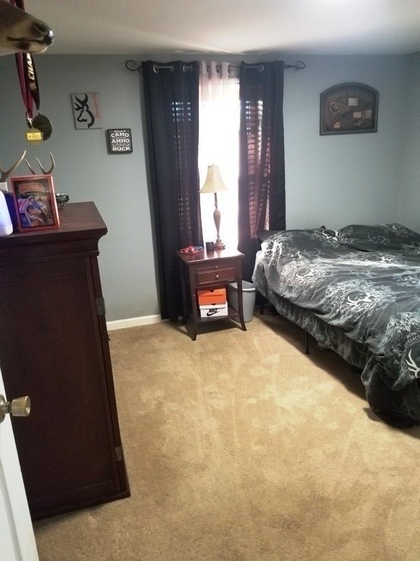 1248 Rutledge Ford Road Decherd, TN 37324 - Photo 10 of 13 a bedroom with a bed and window