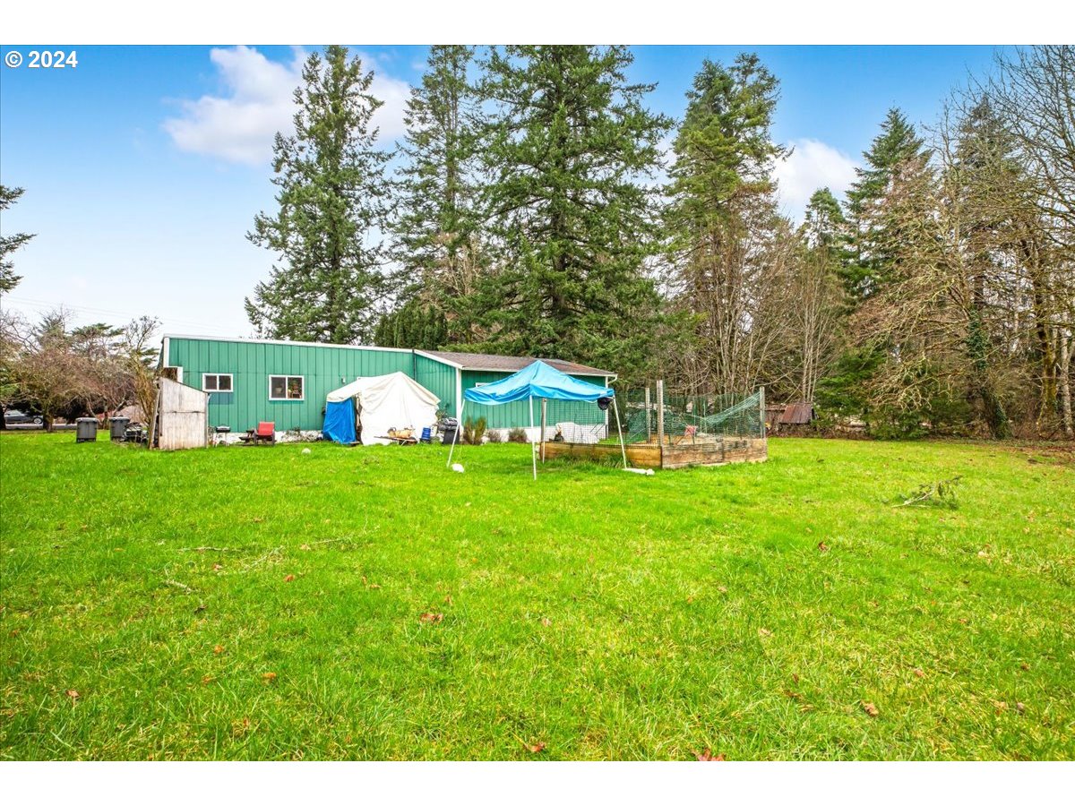 29700 Joe Day Way Grand Ronde, OR 97347 - Photo 11 of 18 a view of an house with backyard space and garden