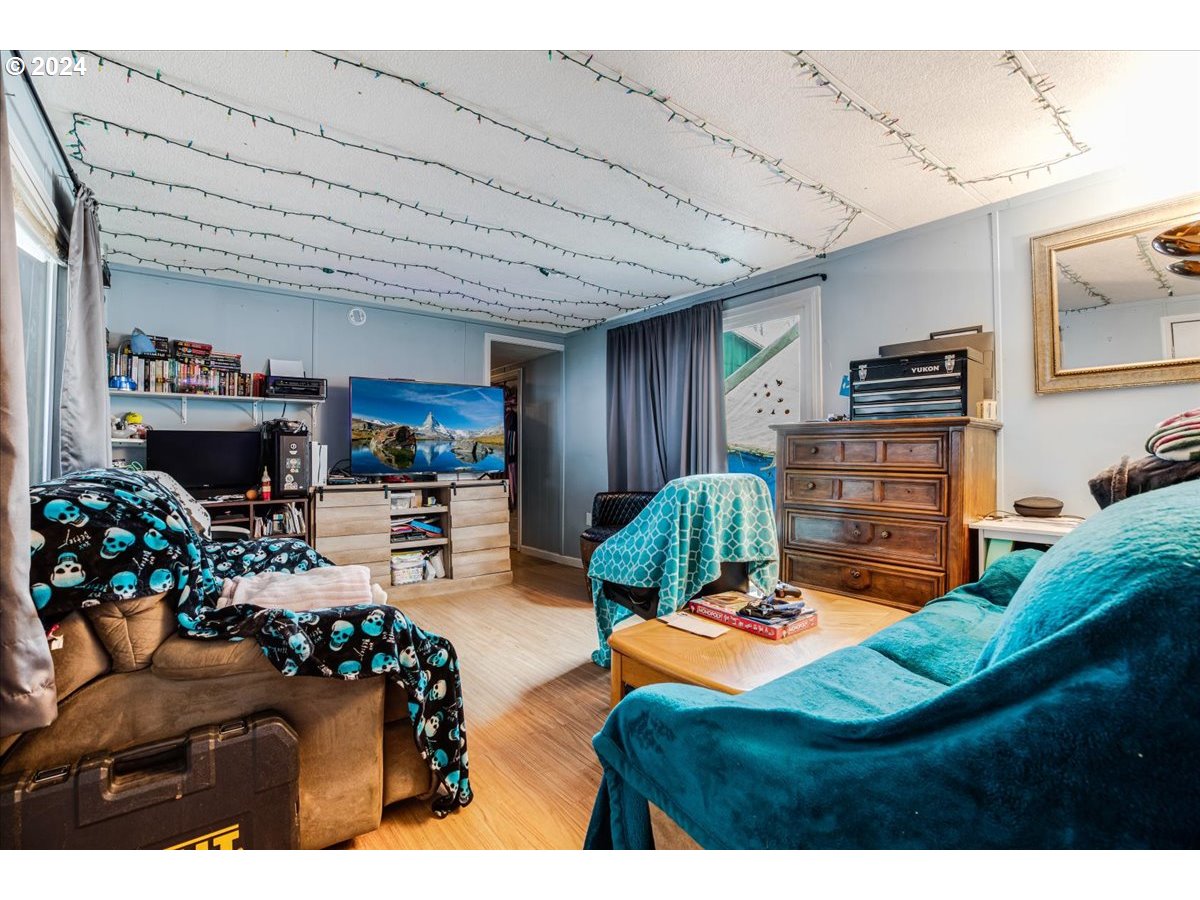 29700 Joe Day Way Grand Ronde, OR 97347 - Photo 6 of 18 a living room with furniture and a flat screen tv
