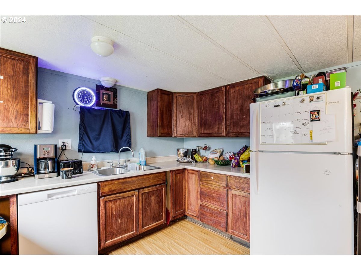 29700 Joe Day Way Grand Ronde, OR 97347 - Photo 8 of 18 a kitchen with a sink cabinets and window