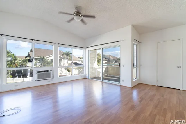 a view of a kitchen with a sink and a refrigerator