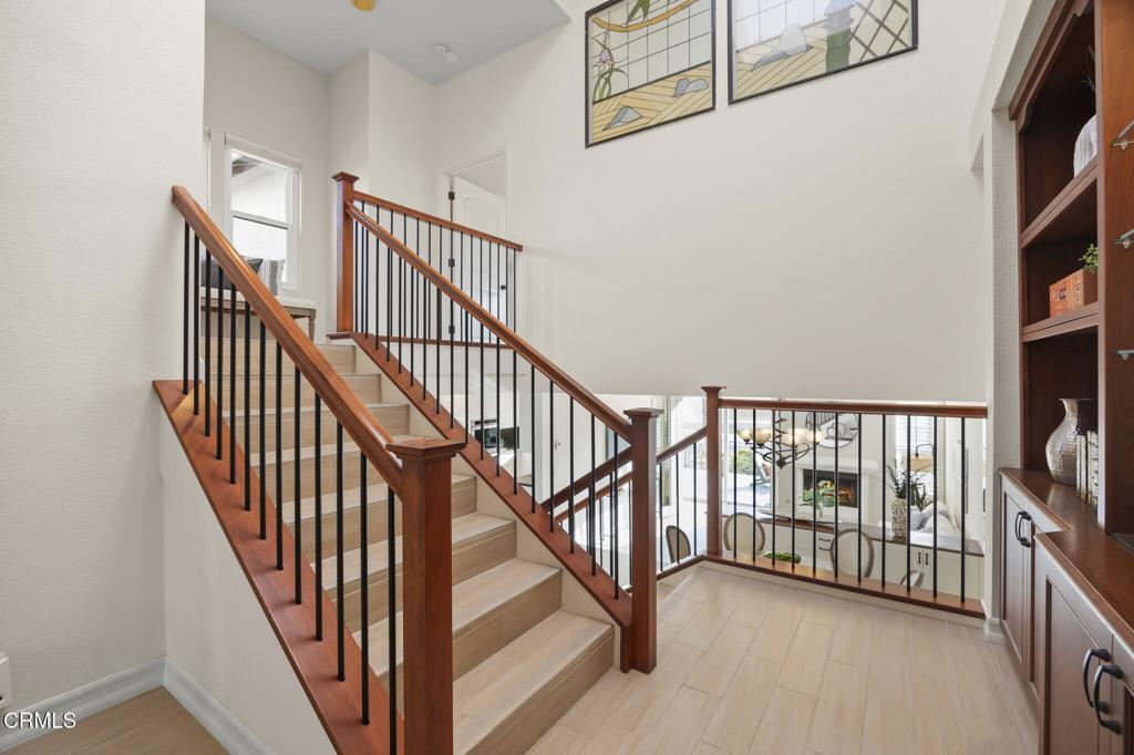 2205 Vina Del Mar Oxnard, CA 93035 - Photo 20 of 60 a view of staircase with lots of frames on wall and a window