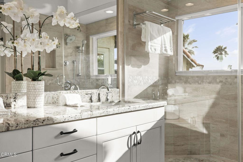 2205 Vina Del Mar Oxnard, CA 93035 - Photo 29 of 60 a bathroom with a granite countertop sink mirror and vanity