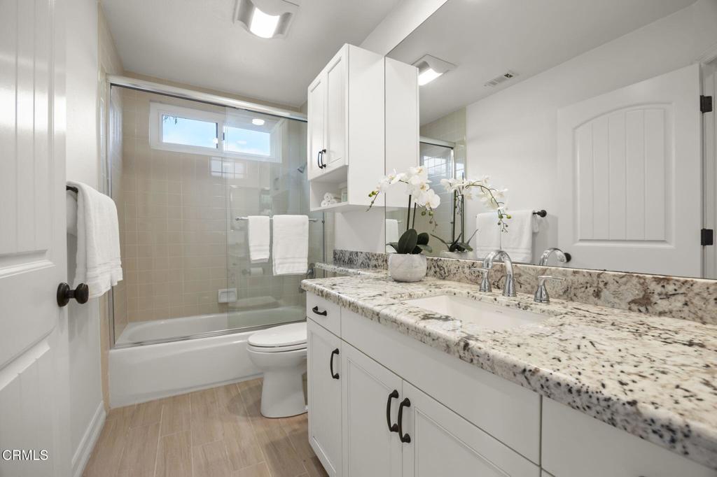 2205 Vina Del Mar Oxnard, CA 93035 - Photo 33 of 60 a bathroom with a granite countertop sink toilet and shower