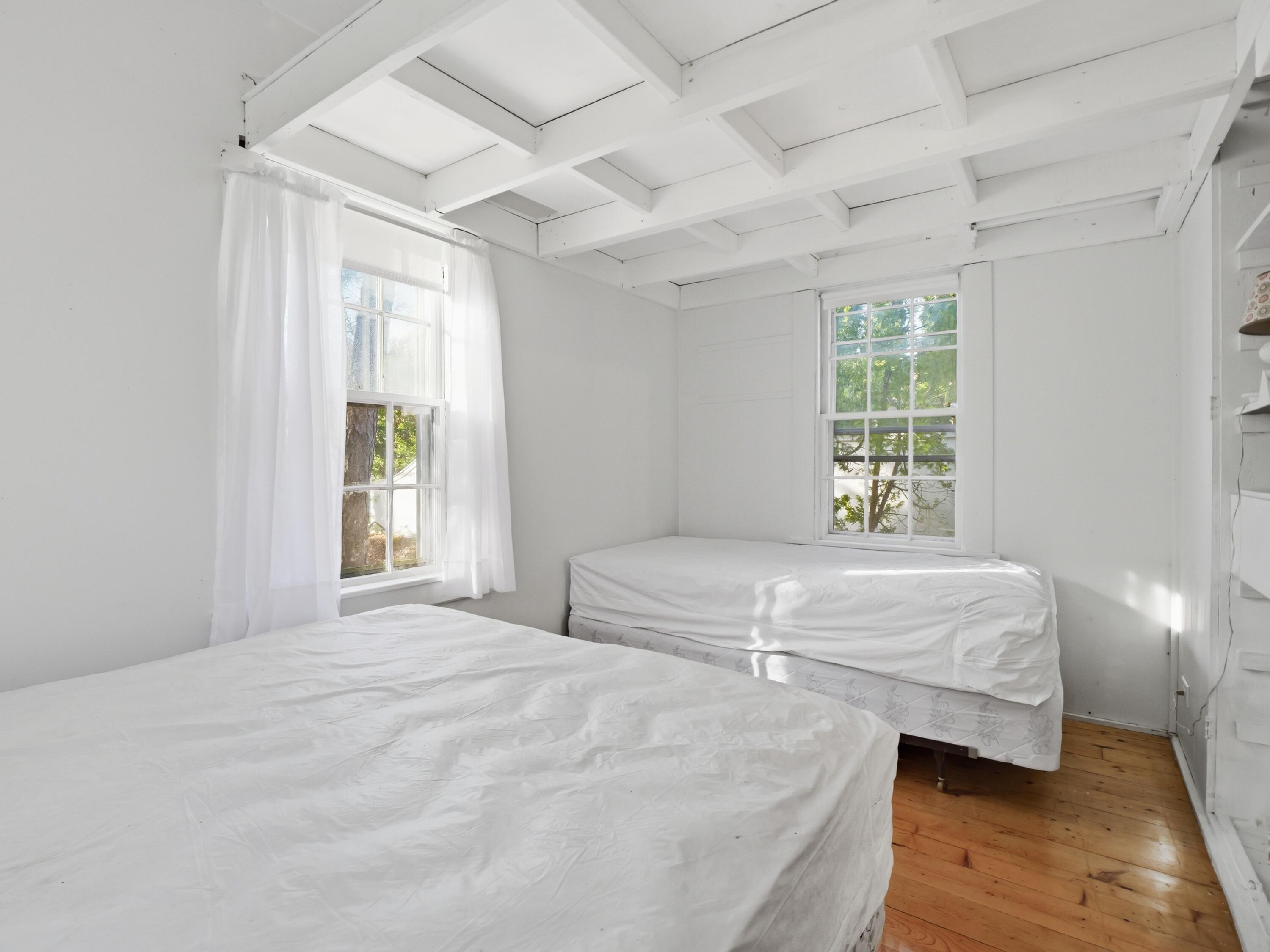 190 Vineyard Road Cotuit, MA 02635 - Photo 40 of 41 a bedroom with a bed and a window