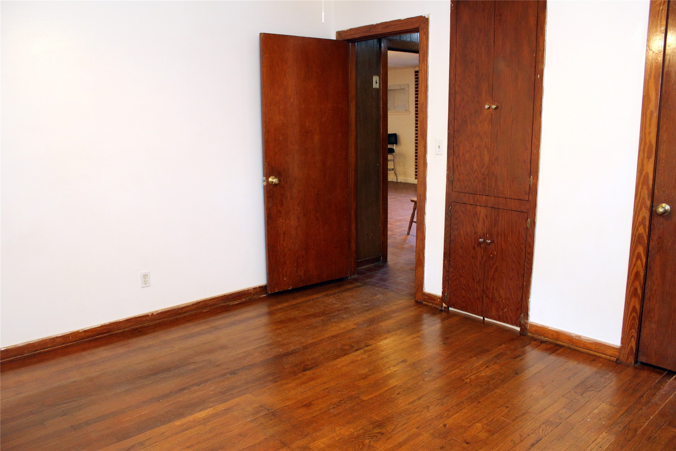 6319 Milwee Street Houston, TX 77092 - Photo 7 of 12 an empty room with wooden floor