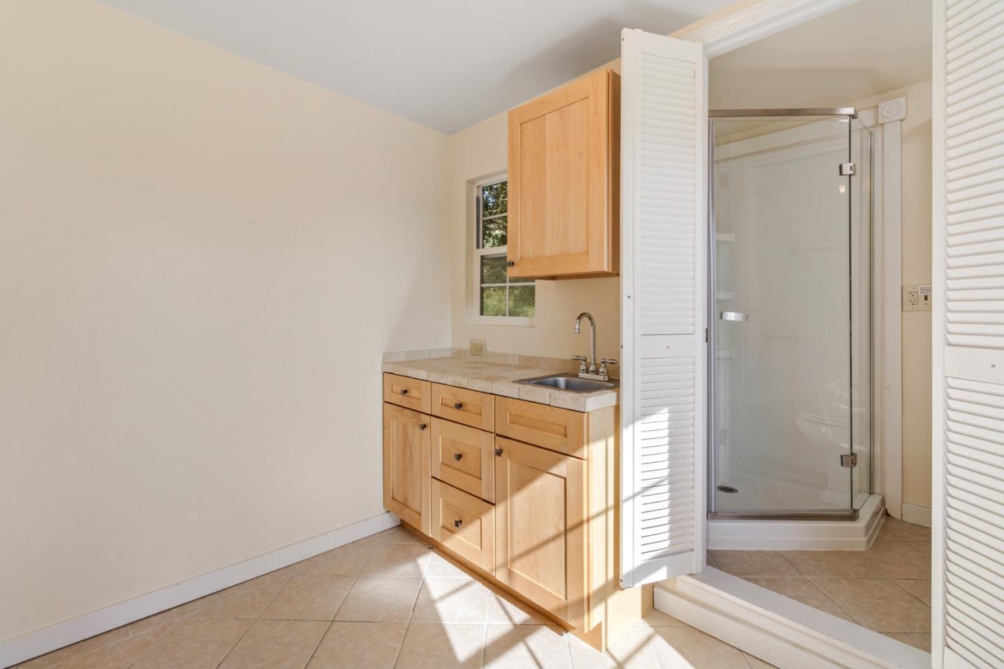 320 El Caminito Road Carmel Valley, CA 93924 - Photo 53 of 62 a bathroom with a granite countertop sink and a mirror