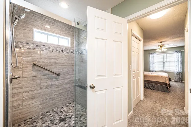 a view of a storage and utility room with washer and dryer