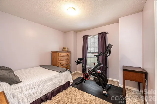 a living room with furniture and a chair