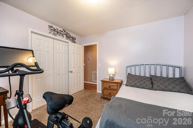 a front view of a house with swimming pool and yard